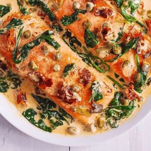 Tuscan Salmon over Sauteed Spinach